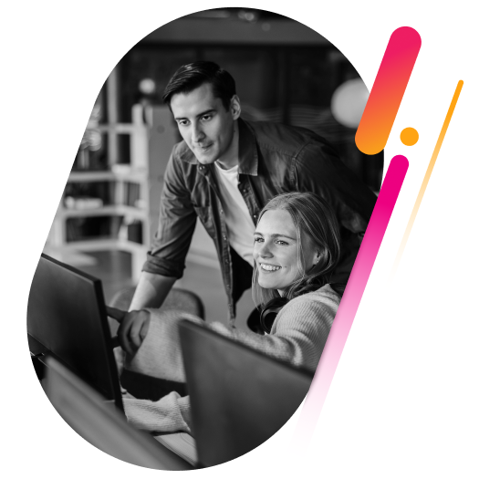 employees looking at desktop monitor