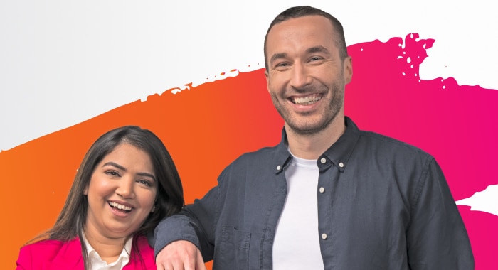 Two happy Splunkers smiling at the camera.