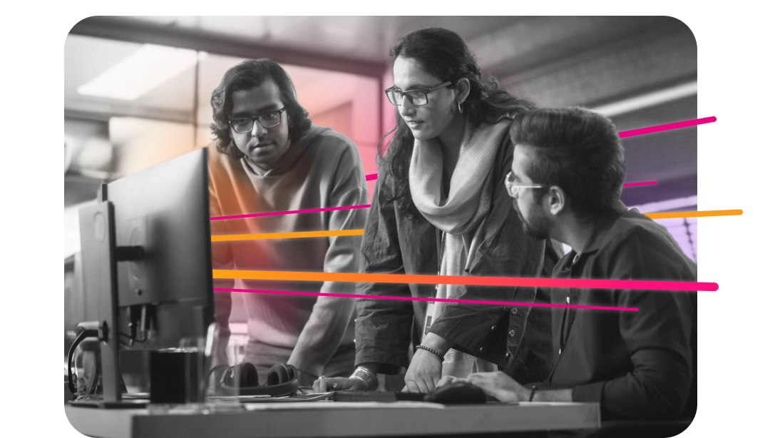 A group of coworkers having a discussion in an office building