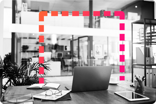 laptop on desk in office