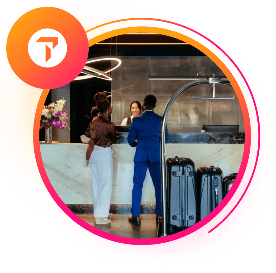 Happy travelers checking into their hotel.